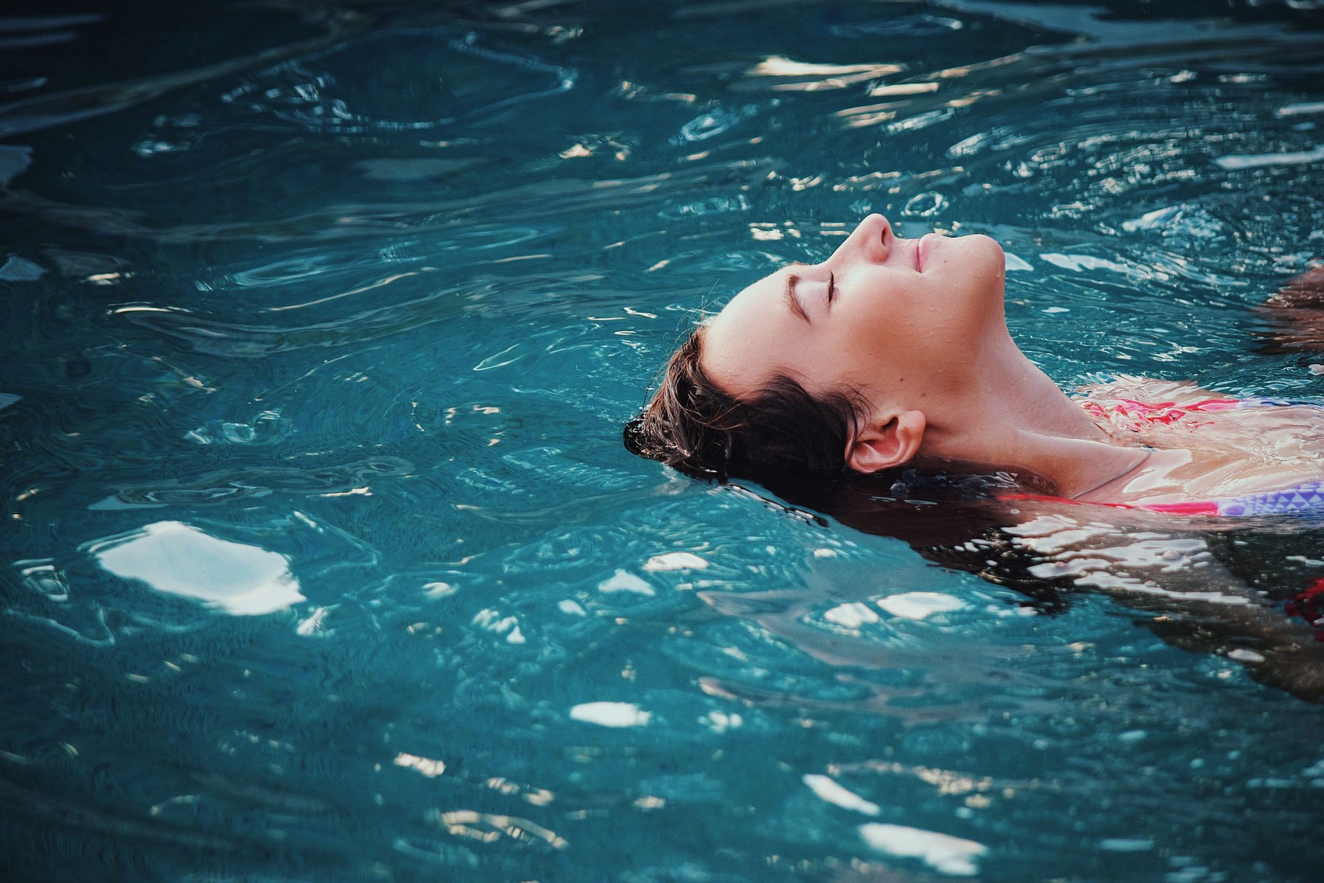 Woman floats in Pool
